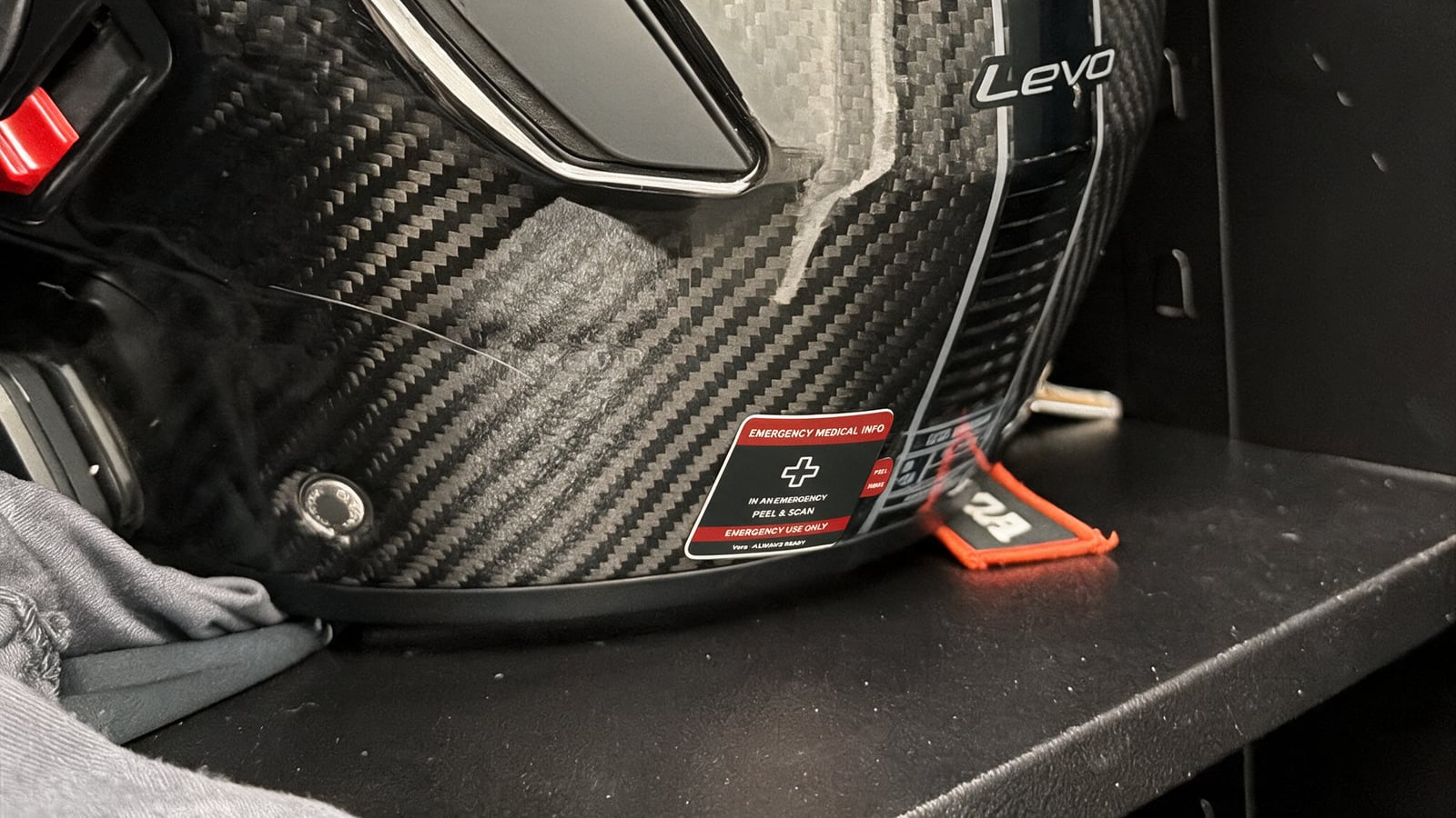 Carbon helmet with a Vera emergency medical sticker